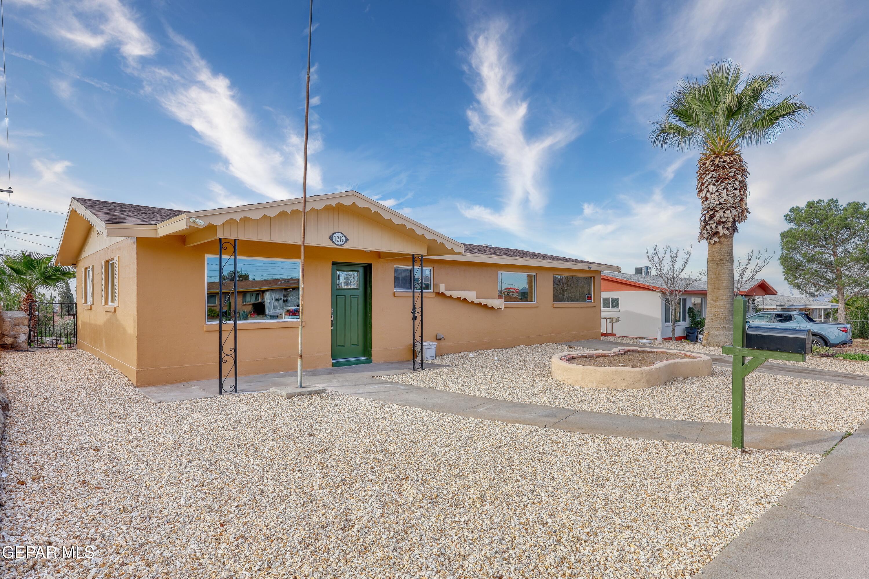7212 Raton Drive El Paso, TX 79915 - Photo 9 of 44 a front view of a house with a yard and garage