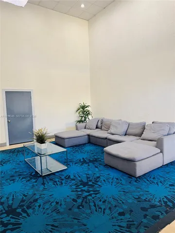a living room with furniture and white walls