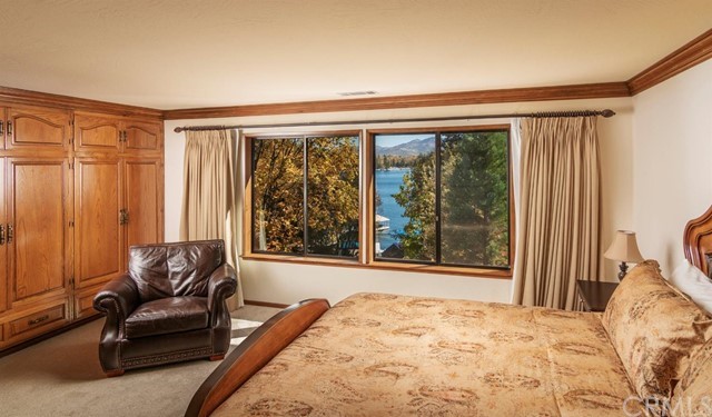 700 Oak Point Lake Arrowhead, CA 92352 - Photo 11 of 20 a bedroom with a large bed and a large window