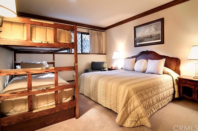700 Oak Point Lake Arrowhead, CA 92352 - Photo 13 of 20 a bedroom with a bed and window