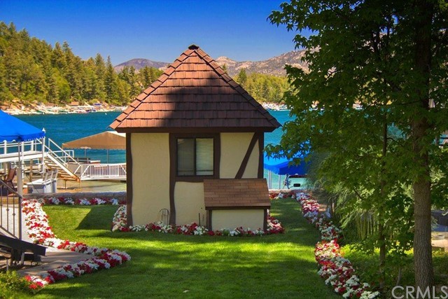 700 Oak Point Lake Arrowhead, CA 92352 - Photo 16 of 20 a front view of a house with garden
