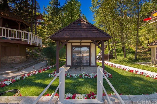 700 Oak Point Lake Arrowhead, CA 92352 - Photo 17 of 20 a front view of a house with garden