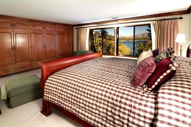 700 Oak Point Lake Arrowhead, CA 92352 - Photo 10 of 20 a bedroom with a bed and a large window