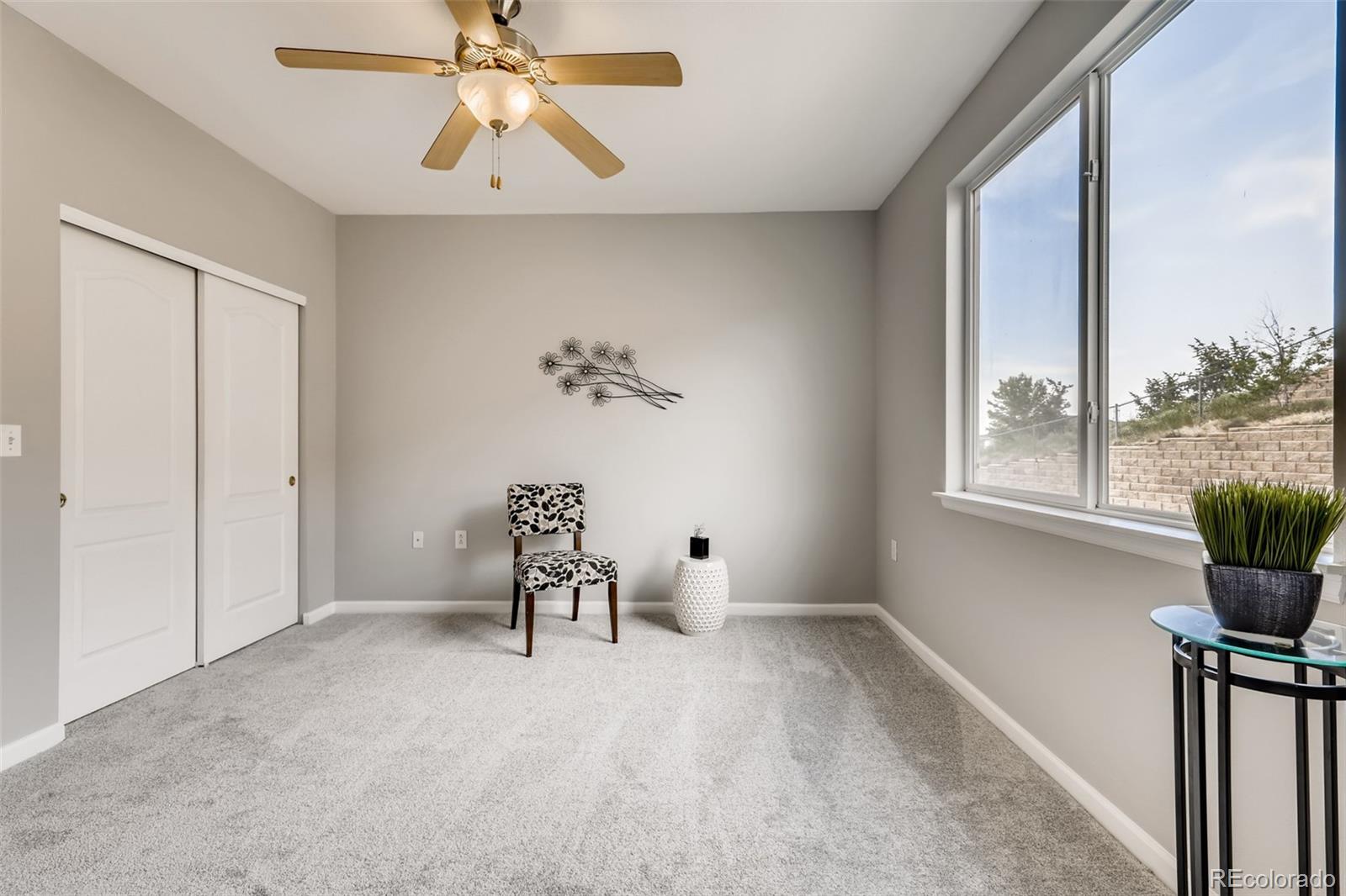 5544 Lewis Street, Unit 203 Arvada, CO 80002 - Photo 21 of 38 a living room with furniture and a window