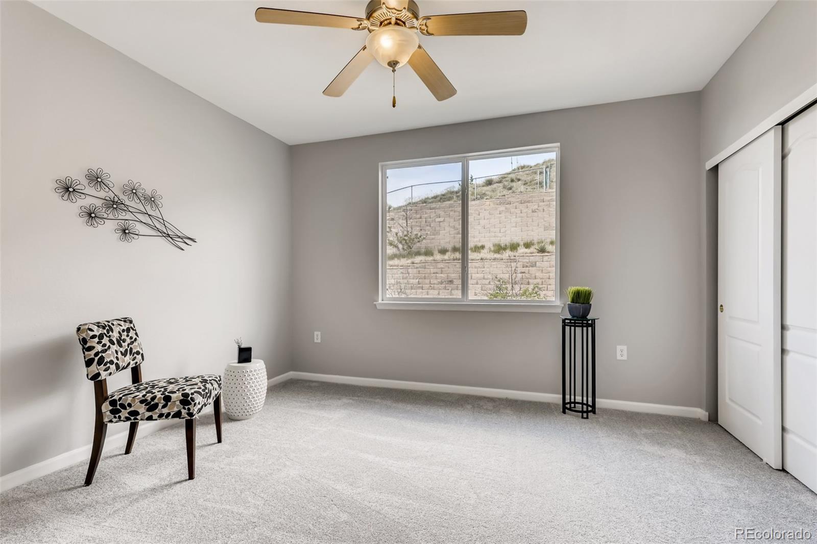 5544 Lewis Street, Unit 203 Arvada, CO 80002 - Photo 22 of 38 a view of workspace with furniture fan and window