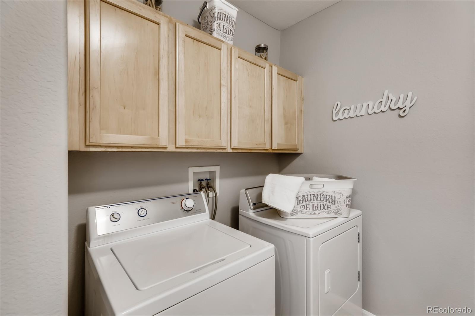 5544 Lewis Street, Unit 203 Arvada, CO 80002 - Photo 25 of 38 a view of storage and utility room with washer and dryer