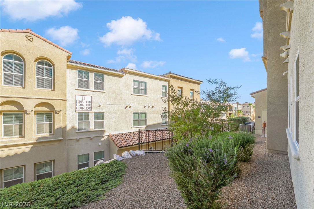 2555 Hampton Road, Unit 10108 Henderson, NV 89052 - Photo 21 of 23 Mediterranean architectural styling highlights the exterior of this multi-level residential complex.