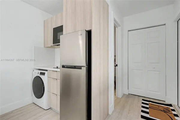 a view of a storage & utility room with washer and dryer
