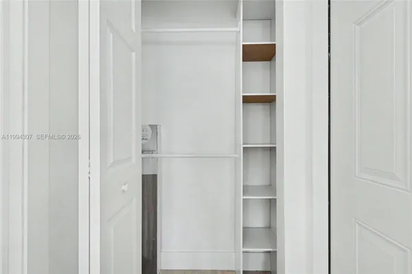 a bathroom with a sink a mirror and shower