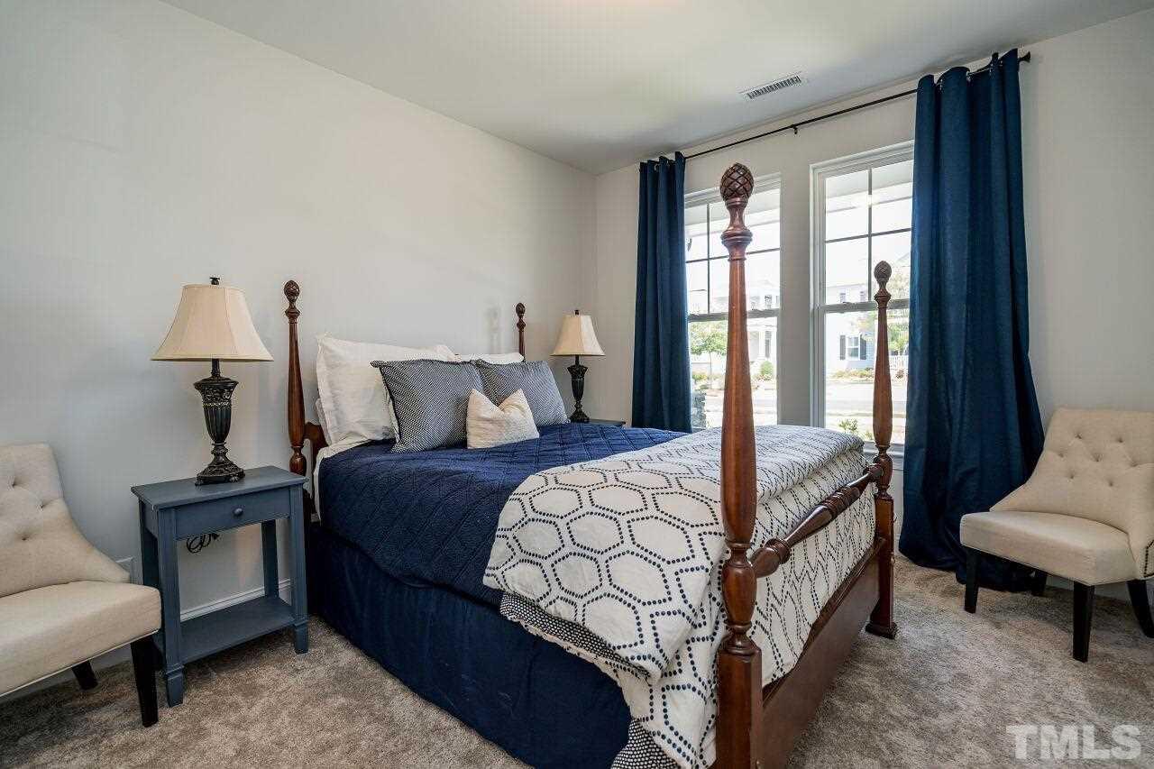5220 Beckom Street Raleigh, NC 27616 - Photo 15 of 30 The first floor guest room with adjacent full bath is a wonderful feature.