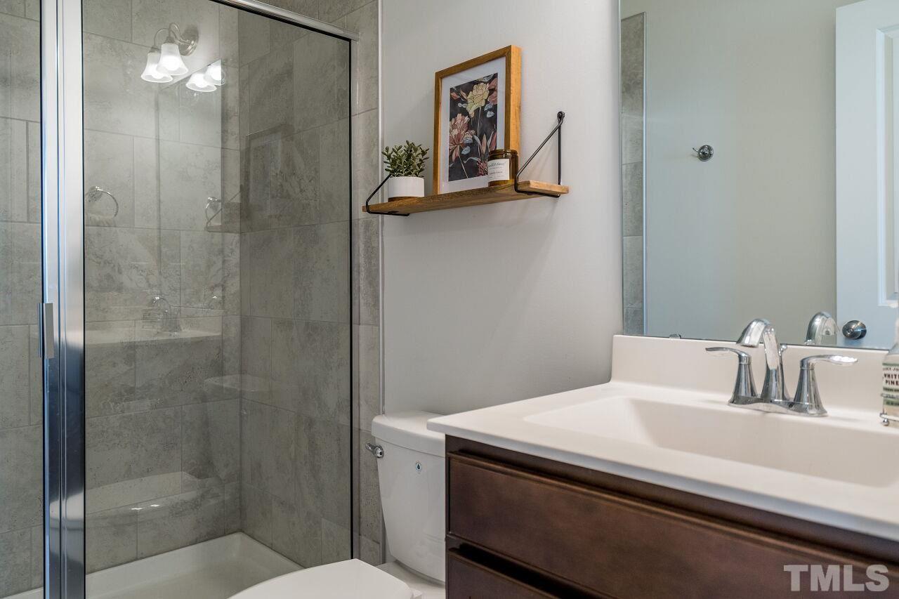 5220 Beckom Street Raleigh, NC 27616 - Photo 16 of 30 This beautiful bath is located on the first floor. Guests will enjoy this space.
