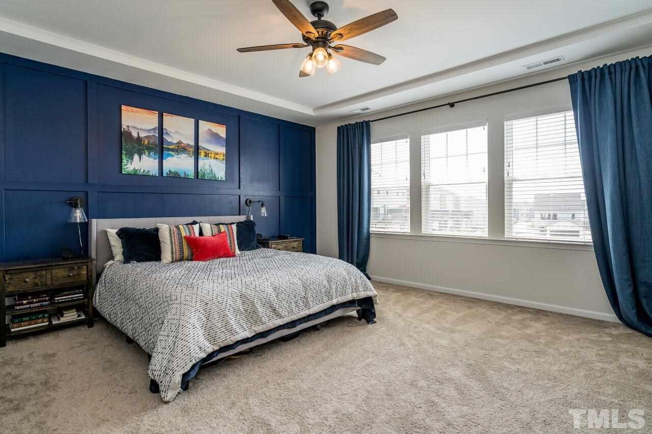 5220 Beckom Street Raleigh, NC 27616 - Photo 17 of 30 The impressive master suite has beautiful molding work.
