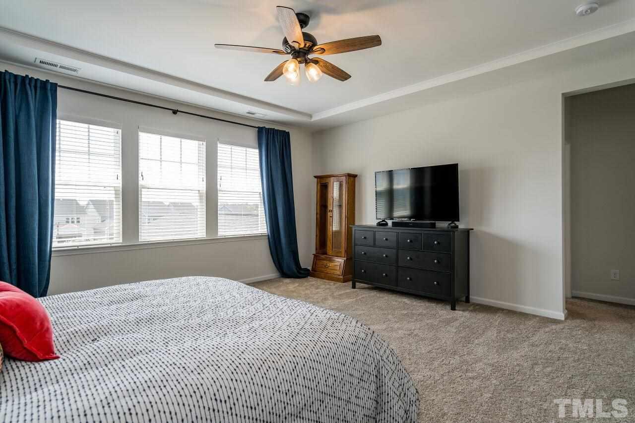 5220 Beckom Street Raleigh, NC 27616 - Photo 18 of 30 The master suite is quite spacious and has a trey ceiling.
