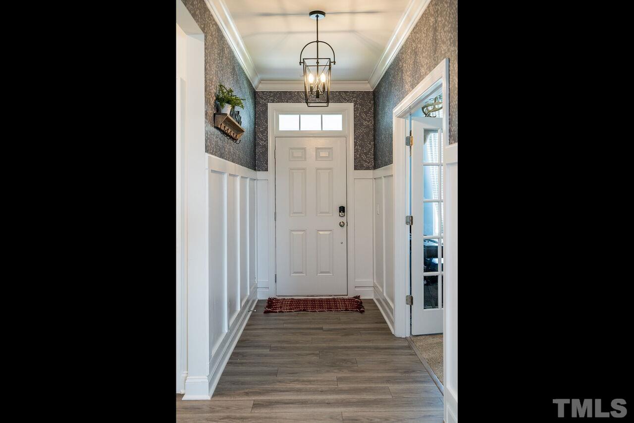 5220 Beckom Street Raleigh, NC 27616 - Photo 3 of 30 Beautiful LVT flooring greets you as you enter this move-in ready home.
