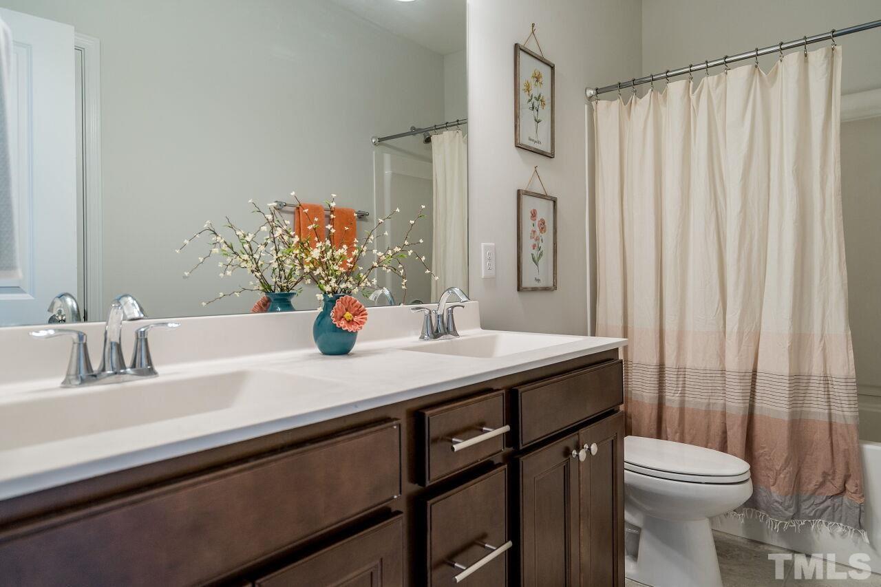 5220 Beckom Street Raleigh, NC 27616 - Photo 22 of 30 Three bathrooms are found in this home and this one has a tub/shower combination.