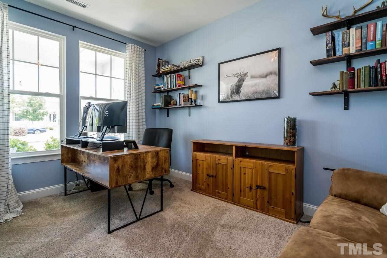 5220 Beckom Street Raleigh, NC 27616 - Photo 4 of 30 Everyone needs a study these days and this one does not disappoint. French doors lead into this lovely space.