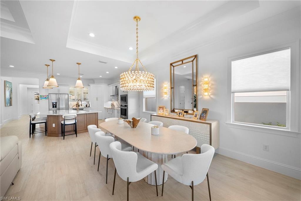 8923 Gustavia Court Naples, FL 34113 - Photo 12 of 50 a view of a dining room and livingroom view