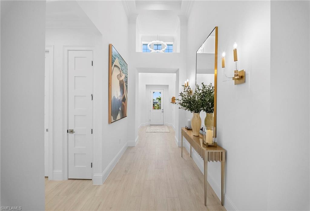 8923 Gustavia Court Naples, FL 34113 - Photo 3 of 50 a view of a hallway to a livingroom with furniture