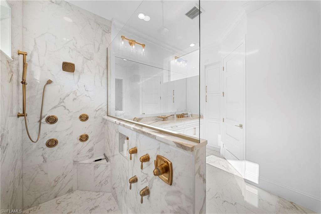8923 Gustavia Court Naples, FL 34113 - Photo 35 of 50 a bathroom with a shower and a sink