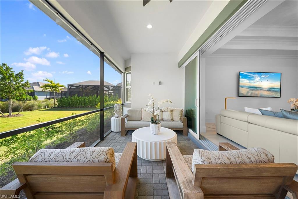 8923 Gustavia Court Naples, FL 34113 - Photo 39 of 50 a outdoor living space with furniture and garden view