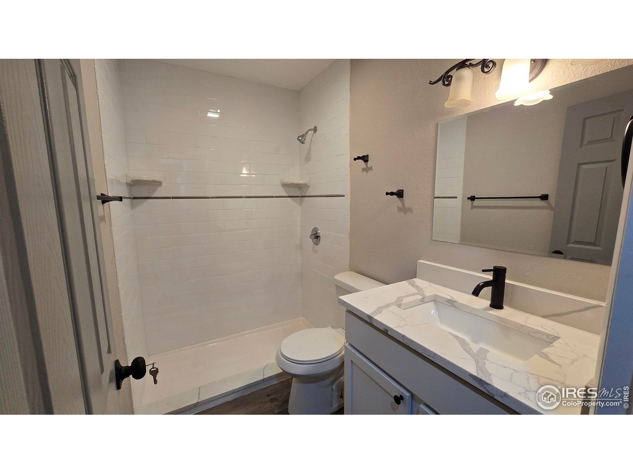 1312 Coolidge Street Sterling, CO 80751 - Photo 18 of 37 MAIN LEVEL 3/4 BATHROOM OFF HALLWAY