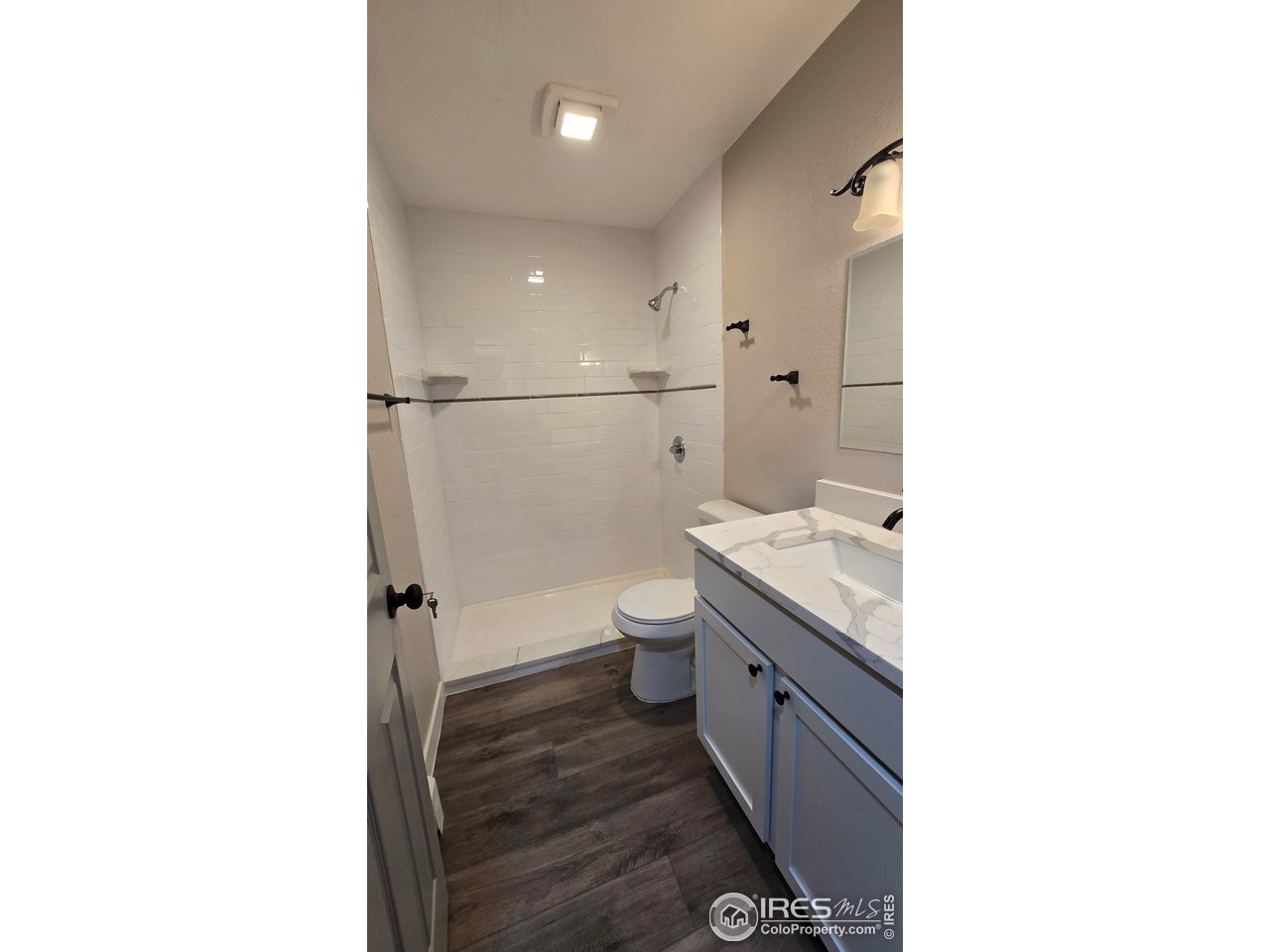 1312 Coolidge Street Sterling, CO 80751 - Photo 19 of 37 MAIN BATHROOM OF HALLWAQY WITH WALKIN SHOWER