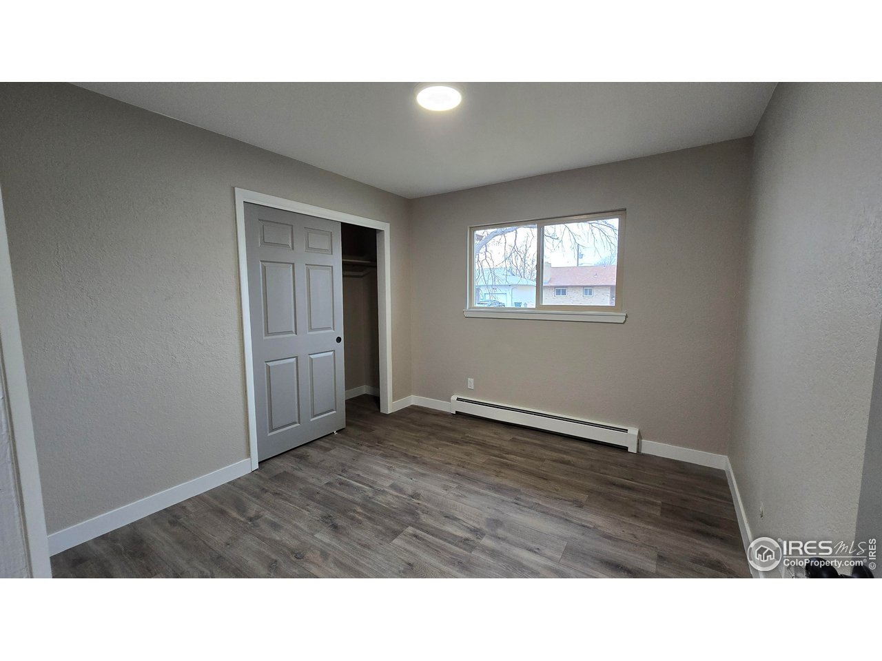 1312 Coolidge Street Sterling, CO 80751 - Photo 24 of 37 BEDROOM ONE FROM HALLWAY, WINDOW FACES THE STREET