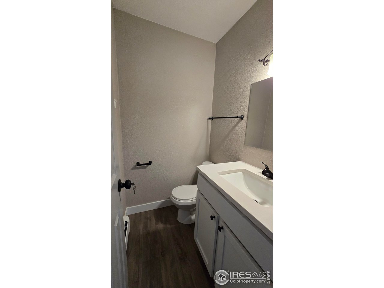 1312 Coolidge Street Sterling, CO 80751 - Photo 26 of 37 HALF BATHROOM OFF THE PRIMARY BEDROOM
