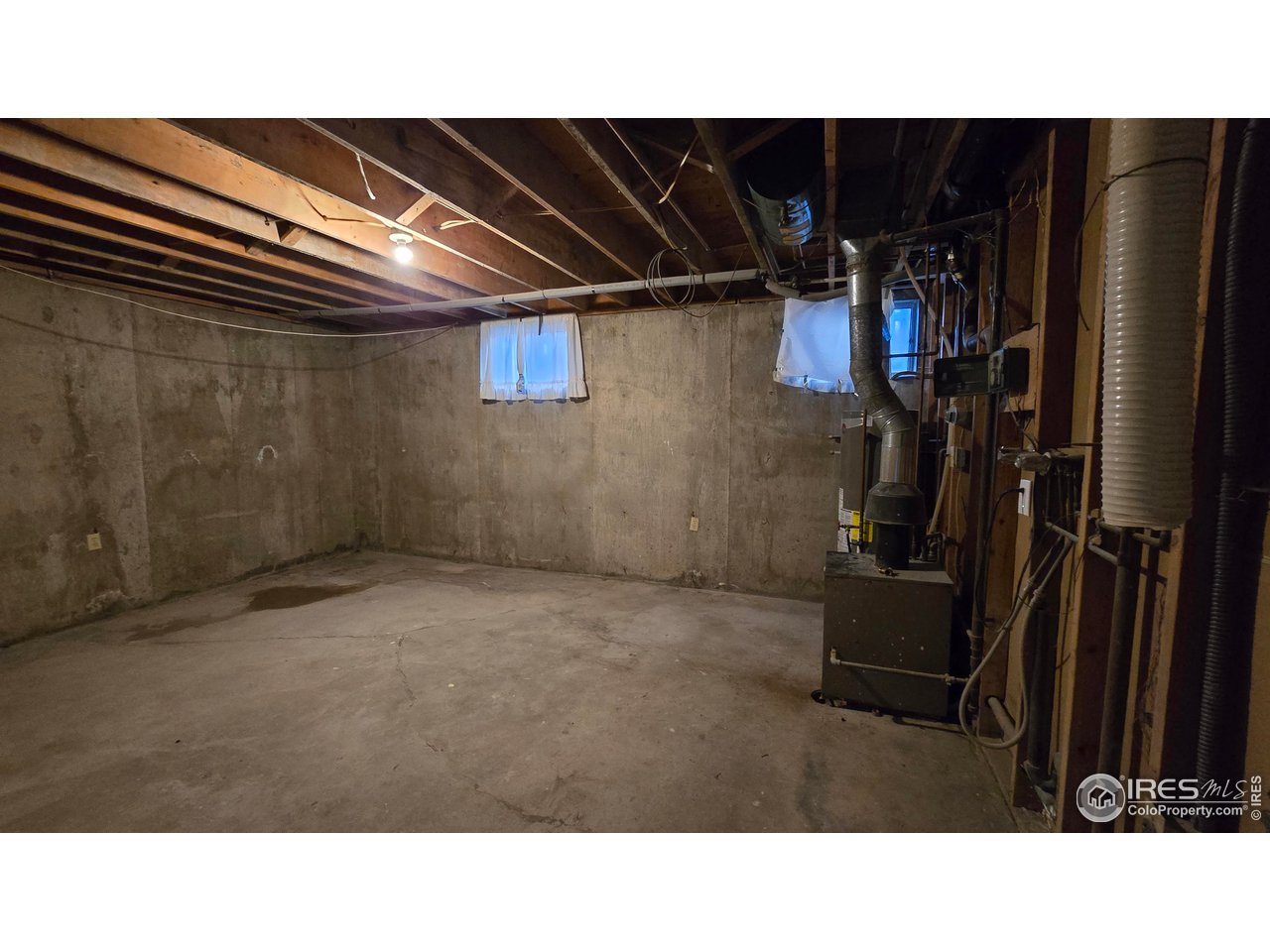 1312 Coolidge Street Sterling, CO 80751 - Photo 29 of 37 MECHANICAL ROOM, WINDOWS FACE BACK YARD
