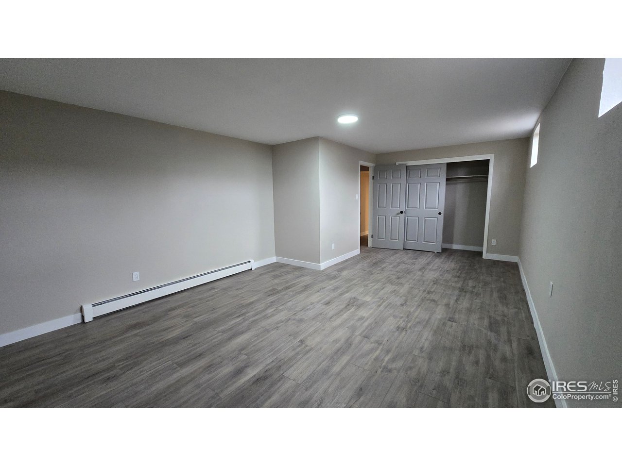1312 Coolidge Street Sterling, CO 80751 - Photo 36 of 37 VIEWE OF LARGE BASEMENT BEDROOM LOOKING TOWARDS THE HALLWAY AND LARGE CLOSET