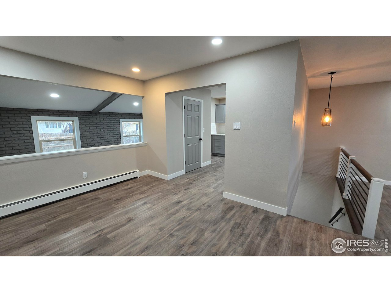 1312 Coolidge Street Sterling, CO 80751 - Photo 5 of 37 VIEW OF DINING ROOM LOOKING INTO THE KITCHEN, OPEN VIEW TO THE FAMILY ROOM OVERLOOKING THE BACK YARD. STAIRS TO BASEMENT ON THE RIGHT