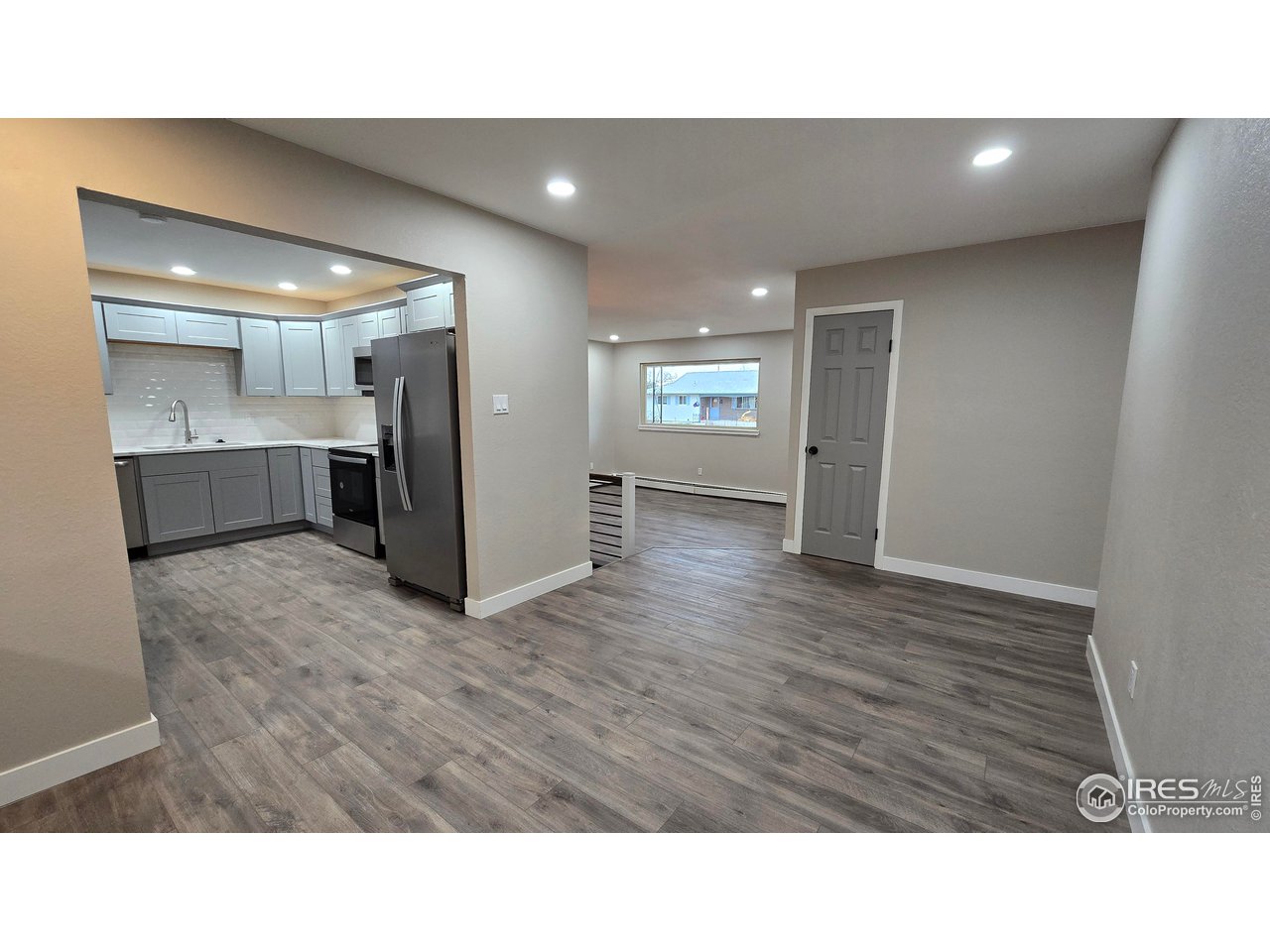 1312 Coolidge Street Sterling, CO 80751 - Photo 7 of 37 DINING ROOM LOOKING TOWARD LIVING ROOM AND UPDATED KITCHEN