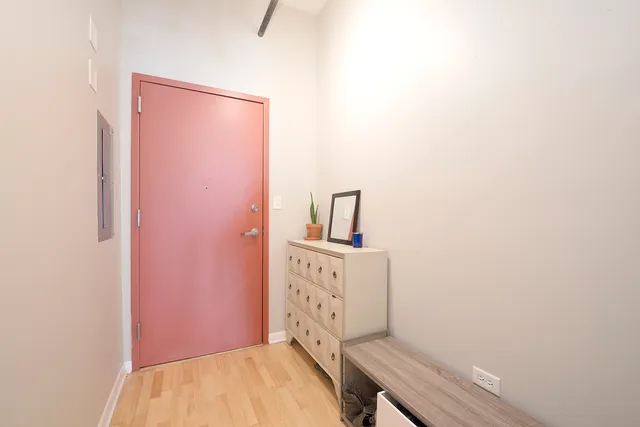 a view of hallway with wooden floor