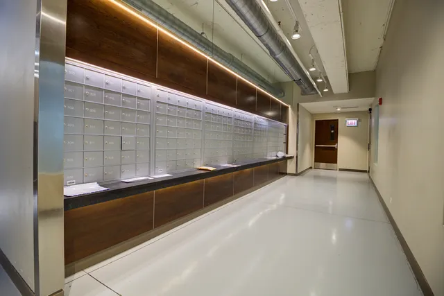 a view of a livingroom with furniture and a kitchen