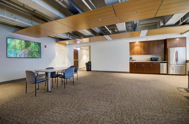 a bathroom with a shower and a sink