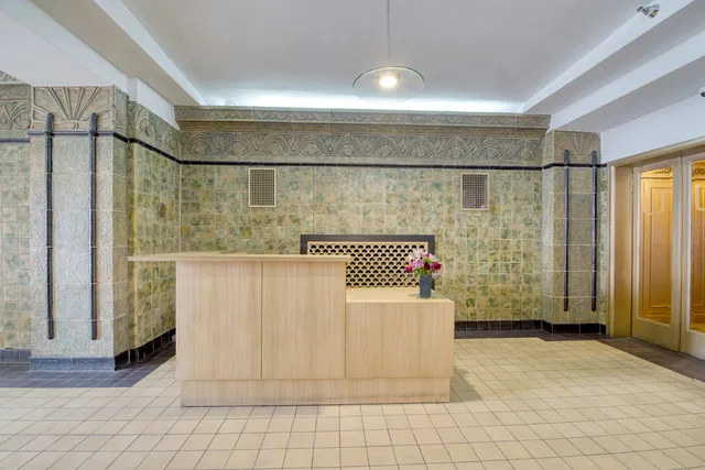 a bathroom with a glass door shower and a sink