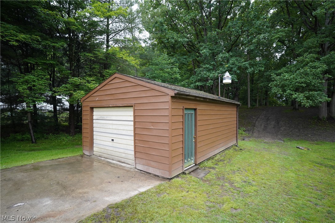 4261 Industry Road Rootstown, OH 44272 - Photo 21 of 25 Detached one car garage with extra storage, electric, and drain.