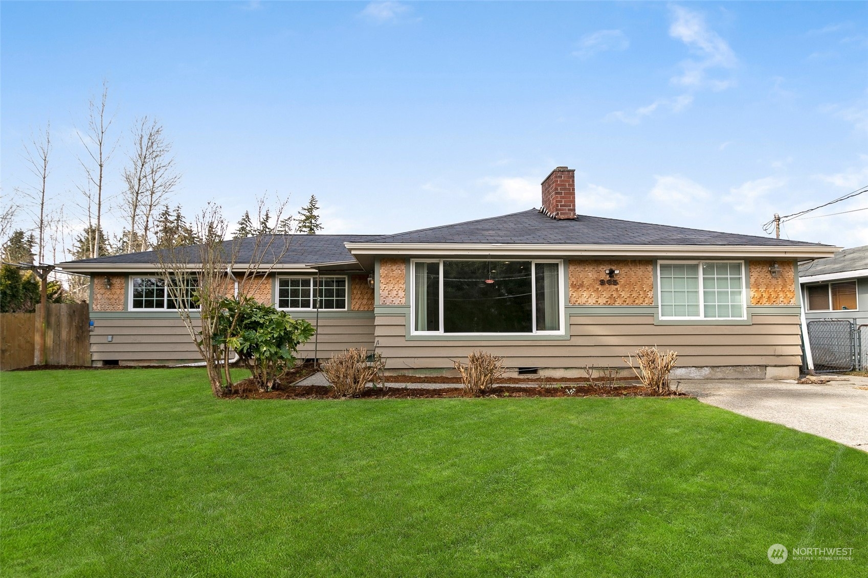 965 Hoquiam Avenue Northeast Renton, WA 98059 - Photo 1 of 37 a front view of a house with a garden