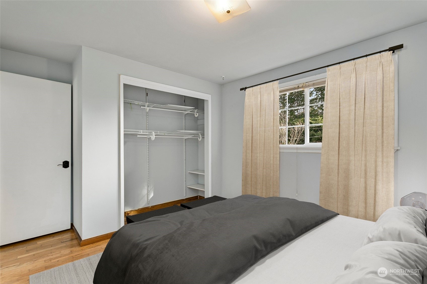 965 Hoquiam Avenue Northeast Renton, WA 98059 - Photo 15 of 37 a bedroom with a bed and a window