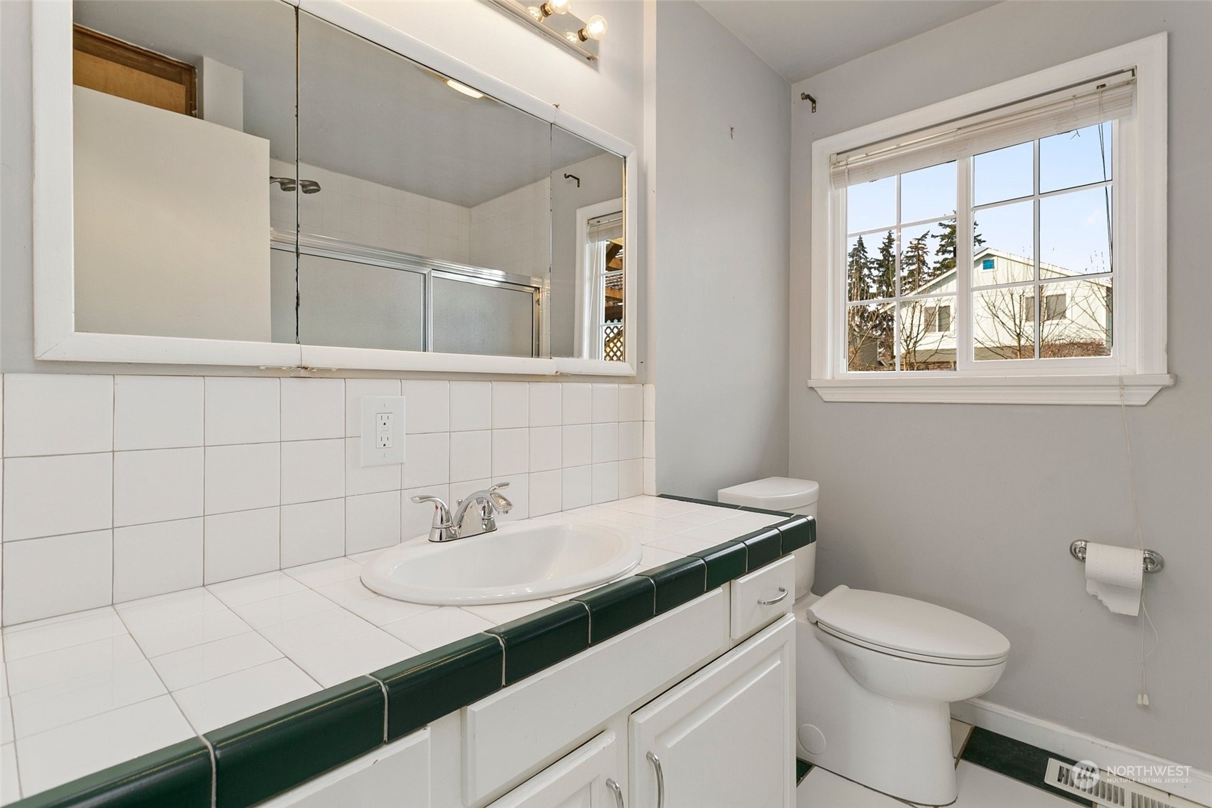 965 Hoquiam Avenue Northeast Renton, WA 98059 - Photo 17 of 37 a bathroom with a sink toilet and window