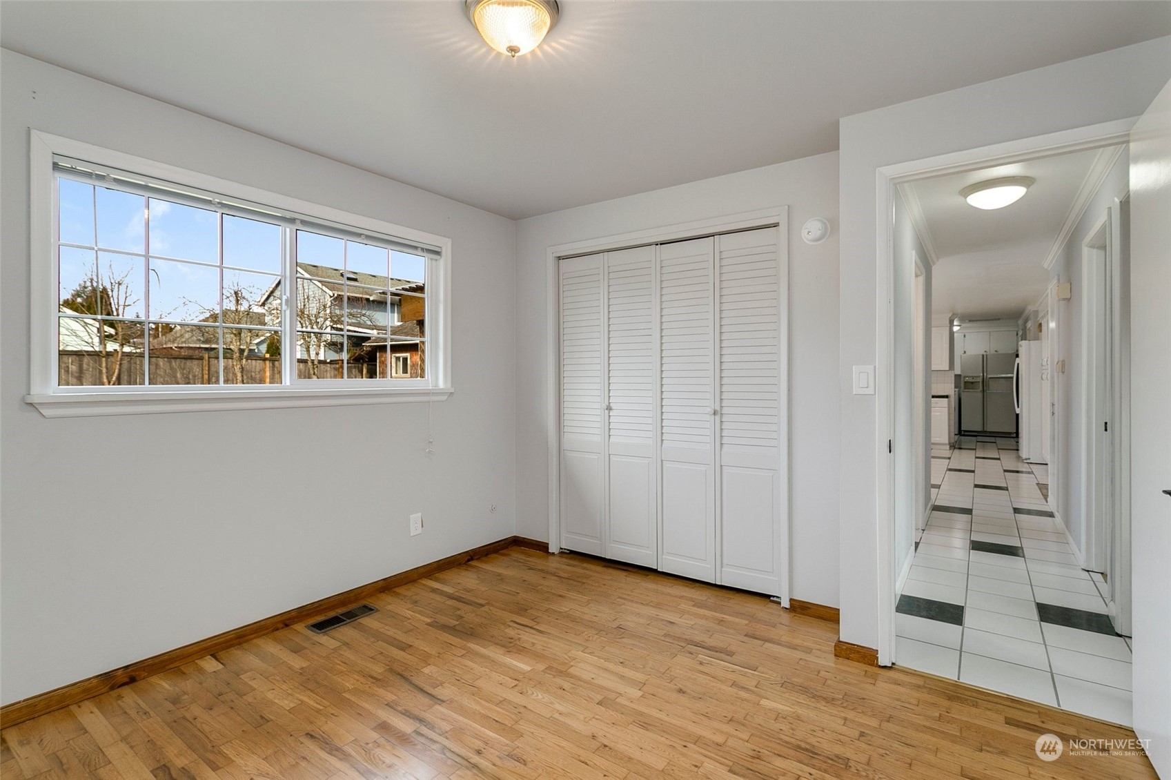 965 Hoquiam Avenue Northeast Renton, WA 98059 - Photo 18 of 37 wooden floor in an empty room with a window