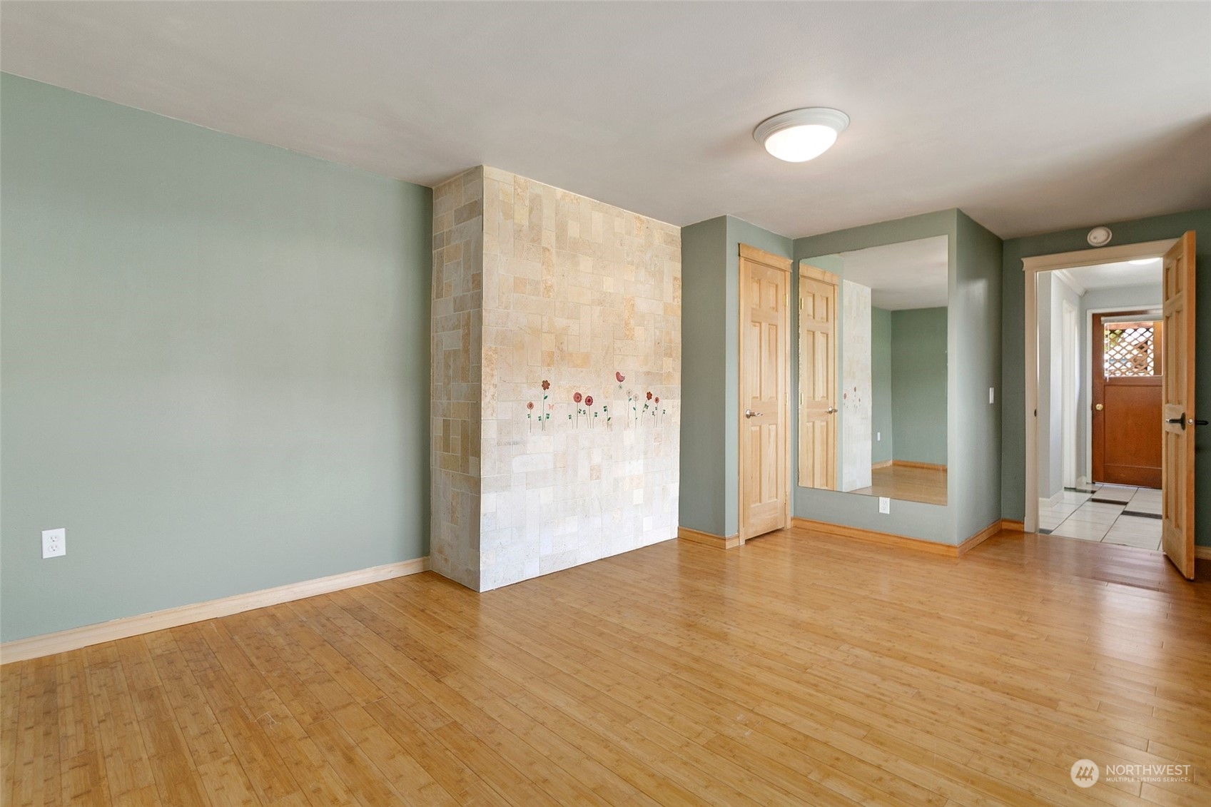 965 Hoquiam Avenue Northeast Renton, WA 98059 - Photo 23 of 37 a view of an empty room with wooden floor and a window
