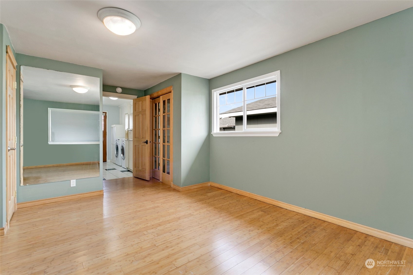 965 Hoquiam Avenue Northeast Renton, WA 98059 - Photo 24 of 37 an empty room with window and bathroom