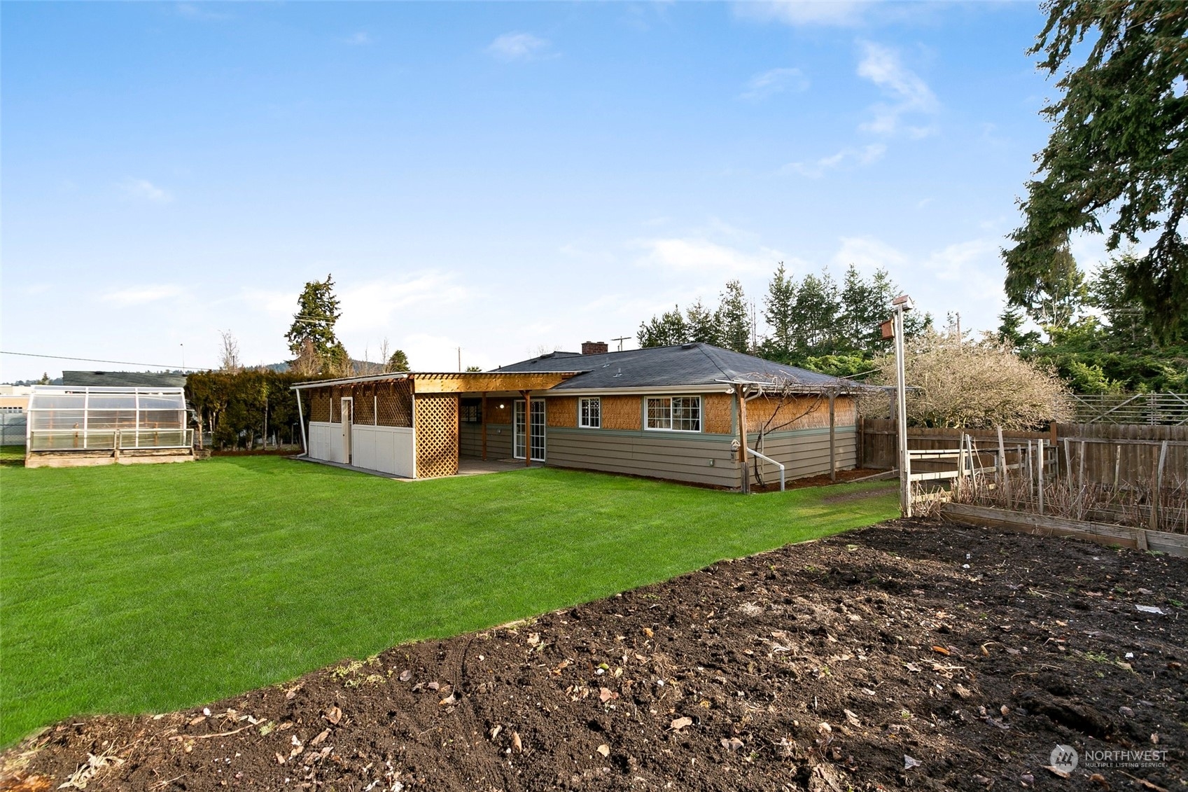 965 Hoquiam Avenue Northeast Renton, WA 98059 - Photo 31 of 37 a view of a house with backyard and garden
