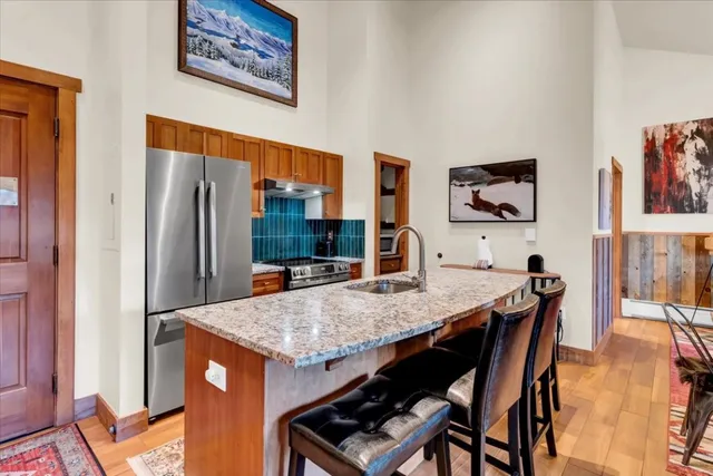 a dining room with a table and chairs
