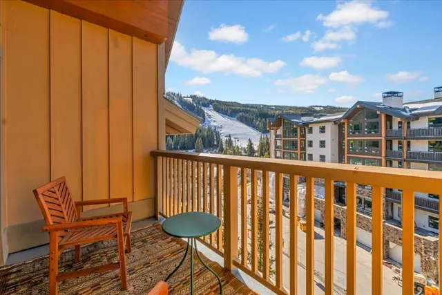 a bedroom with a bed and a lamp on table