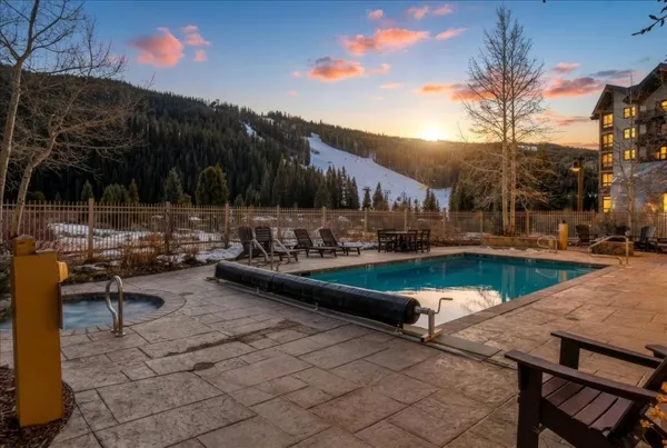 a view of a swimming pool with a patio