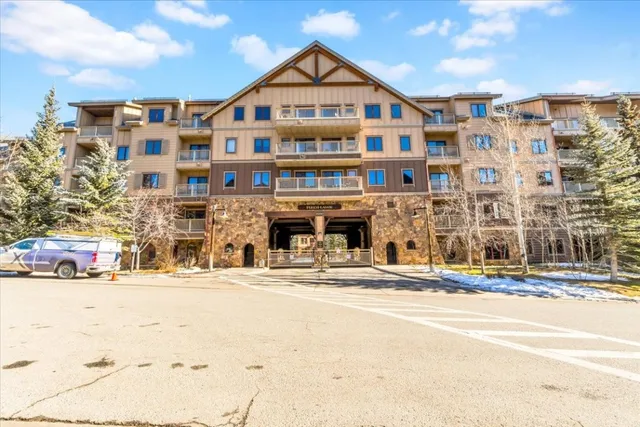 a view of a building with a swimming pool