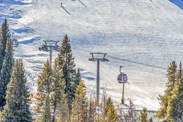 a view of a parking space in between of two buildings