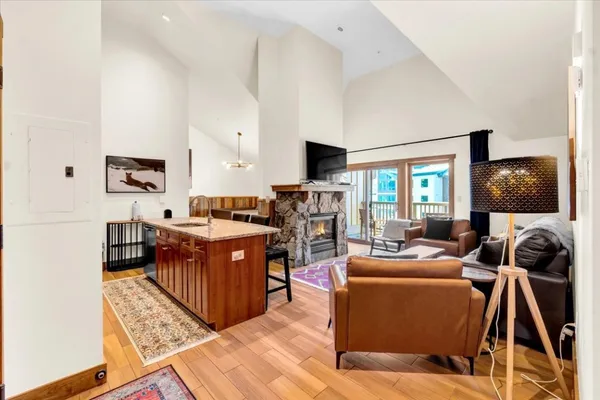 a view of kitchen island kitchen island granite countertop wooden cabinets and stove